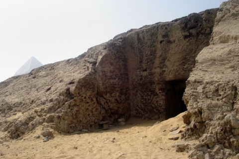 Figure 5. Entrance to tomb NC2 during recent SCA excavations, with the pyramid of Khafre in the background (SCA photo).